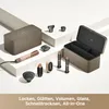 A collection of hair styling tools and accessories arranged on a multi-level white and gray surface. Produktbild-Vorschau