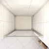 A top-down view of a modern shower enclosure with glass doors and silver-colored metal framing, set against a backdrop of marble-patterned tiles on the walls and ceiling, and white tiled flooring. Produktbild-Vorschau