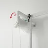 A close-up view of a white roller blind mechanism mounted on a white wall. Produktbild-Vorschau