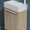 A close-up view of a bathroom vanity with a white sink and a wooden cabinet. Produktbild-Vorschau