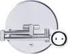 A close-up, studio shot of a wall-mounted cosmetic mirror with a chrome finish. Produktbild-Vorschau