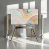 A modern TV stand with a large flat-screen TV and two tall speakers. Podgląd zdjęcia produktu