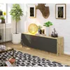 A modern living room scene featuring a dresser, plants, and decorative items. Produktbild-Vorschau