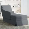 A dark gray chaise lounge with a bolster pillow is shown in a living room setting. Podgląd zdjęcia produktu