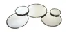 A decorative mirror with multiple circular and oval mirror pieces arranged in a cluster, framed with a thin gold-colored metal rim. The mirrors are mounted on a white background. Podgląd zdjęcia produktu
