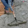 A construction worker is using a concrete spreader to level wet concrete on a construction site. Produktbild-Vorschau