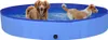 Two dogs are playing in a blue inflatable pool. Náhled obrázku produktu