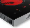 A close-up view of a black electric vitroceramic cooktop with a glowing red heating element and digital displays. Produktbild-Vorschau