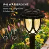 A solar garden light is shown in a garden setting with rain falling. Produktbild-Vorschau
