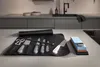 A knife roll with knives and a sharpening stone on a kitchen counter. Anteprima dell’immagine prodotto