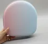 A hand holding a protective case for headphones. Produktbild-Vorschau