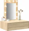 A vanity table with a lighted mirror, a drawer, and decorative items on top. Náhled obrázku produktu