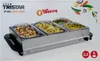 The image shows the packaging of a Tristar buffet server. The packaging displays the product itself with food inside, along with branding and marketing text. Voir les images du produit