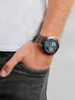A man's wrist wearing a watch, with his hand in his pocket. Produktbild-Vorschau