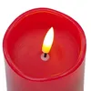 A close-up view of the top of a red LED candle with a flickering flame. Produktbild-Vorschau