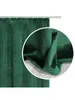 A close-up view of a dark green velvet curtain, showing its texture and drape. Produktbild-Vorschau