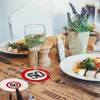A table setting with food, drinks, and coasters. Produktbild-Vorschau