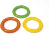 Three inflatable rings in green, orange, and yellow are arranged in a cluster on a white background. Voir les images du produit