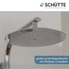A close-up view of a modern, round shower head with multiple small water jets, mounted on a sleek chrome arm. Podgląd zdjęcia produktu