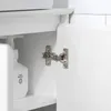Close-up view of a cabinet hinge and a bottle of liquid shampoo inside a white cabinet. Produktbild-Vorschau