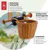 Close-up of a child's bicycle handlebar with a basket and descriptive labels. Náhled obrázku produktu