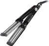 A black and silver hair curling iron is shown against a white background. Náhľad obrázku produktu