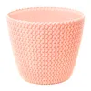 A pink knitted-look plant pot on a white background. Anteprima dell’immagine prodotto