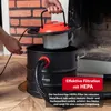 A person is assembling or disassembling a black ash vacuum cleaner with an orange lid and a HEPA filter. Produktbild-Vorschau