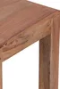 A close-up view of the corner of a wooden table. Anteprima dell’immagine prodotto