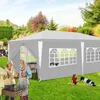 A family and their dog enjoying a backyard gathering under a large gray canopy tent. Produktbild-Vorschau