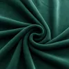 A close-up view of dark green fabric, folded and swirled. Podgląd zdjęcia produktu