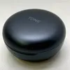 A closed black charging case for wireless earbuds, with the brand name 'TONE' embossed on the top. Produktbild-Vorschau