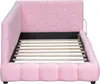 A pink upholstered bed frame with a slatted base. Náhled obrázku produktu