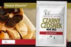 A product image featuring black garlic and a package of black garlic capsules. Produktbild-Vorschau