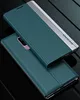 A teal and silver flip phone case is shown from a diagonal angle, with another identical case underneath it. Produktbild-Vorschau