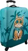 A suitcase cover with a cartoon cat wearing sunglasses and a hat, set against a tropical background with palm trees and birds. Anteprima dell’immagine prodotto