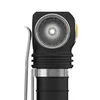 Close-up of a flashlight head with a textured lens and a metal clip. Produktbild-Vorschau