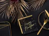 A New Year's Eve table setting with black and gold accents. Produktbild-Vorschau