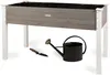 A raised garden bed with gardening tools. Produktbild-Vorschau