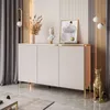 A modern living room with a beige three-door sideboard, decorated with a bust, a painting, and dried flowers. A golden cat statue sits beside it. Produktbild-Vorschau
