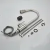 A disassembled kitchen faucet and its components are laid out on a light gray surface. Produktbild-Vorschau
