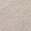 A close-up texture shot of a cream-colored carpet. Náhled obrázku produktu