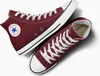 A pair of maroon Converse Chuck Taylor All Star high-top sneakers are displayed against a white background. Produktbild-Vorschau