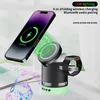 A multi-functional charging station with a phone, smartwatch, and speaker, with glowing green charging indicators and musical notes. Produktbild-Vorschau