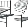 A collage of four close-up images of a black metal bed frame, showing different angles and details of its construction. Voir les images du produit