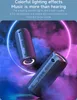 Two black cylindrical speakers are shown in a smoky, colorful environment with neon light rings around them. Produktbild-Vorschau