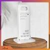 A white weather station is displayed on a wooden stand against a textured white wall. Anteprima dell’immagine prodotto