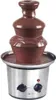 A chocolate fountain with melted chocolate flowing down its tiers, set against a white background. Podgląd zdjęcia produktu