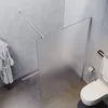 A modern bathroom with a walk-in shower, toilet, and bathrobe. Produktbild-Vorschau
