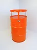An orange barrel-shaped table with a circular top and a raised rim, standing in a corner against a white background. Podgląd zdjęcia produktu
